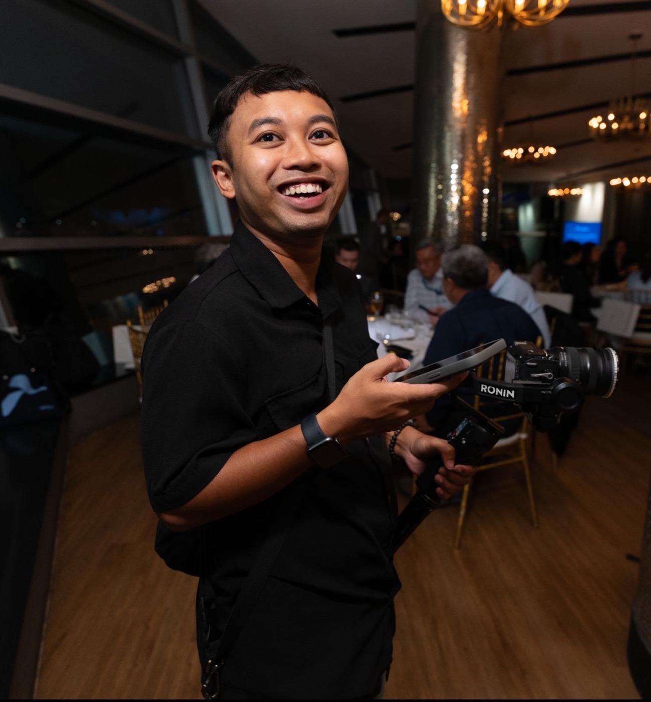 Nazrul Syafiiy holding a gimbal camera